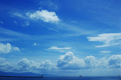 Low angle view of sea against blue sky