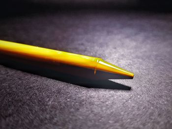 Close-up of yellow pencils on table