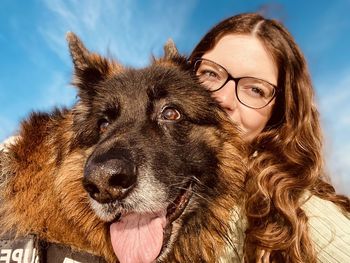 Portrait of young woman with dog