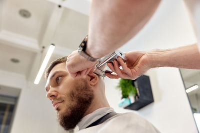 Cropped image of a young man working at home