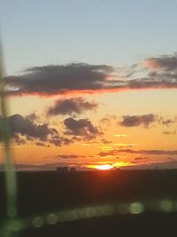 Scenic view of dramatic sky during sunset