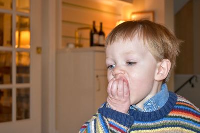 Close-up of cute boy at home