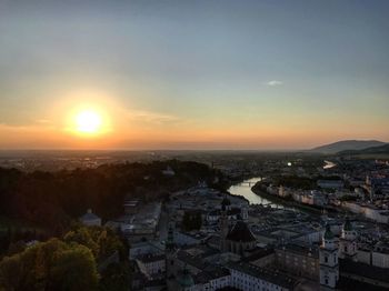 High angle shot of townscape against sky at sunset