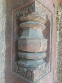 Close-up of old metal door on building