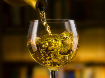 Close-up of wineglass on glass