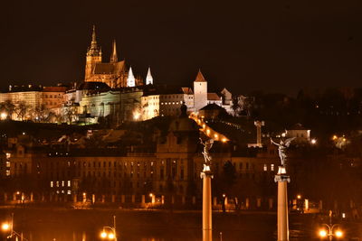 Illuminated buildings in city at night