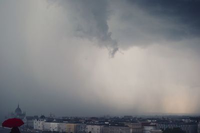 View of city against cloudy sky