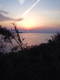 Scenic view of sea against sky at sunset