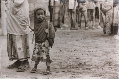 Portrait of smiling girl standing outdoors