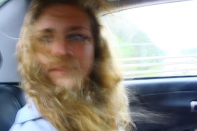 Close-up of woman in car