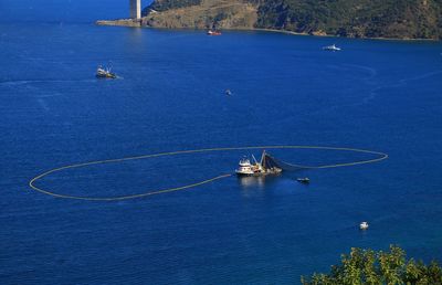 High angle view of sailboat sailing on sea against sky