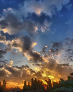 Low angle view of dramatic sky during sunset