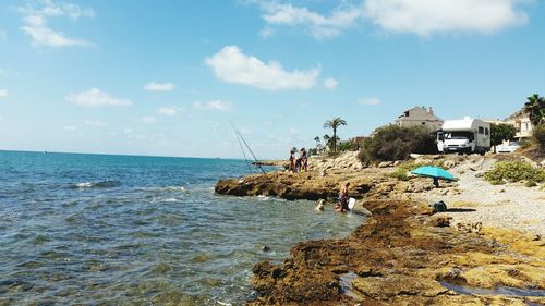 Scenic view of sea against cloudy sky