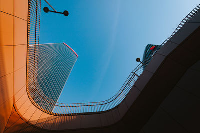 Low angle view of buildings against blue sky