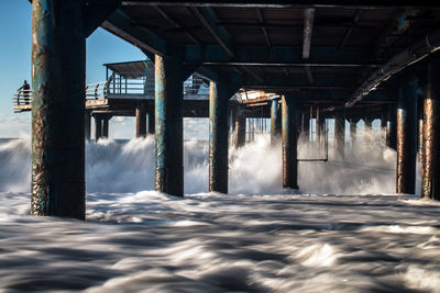 View of pier over sea against sky