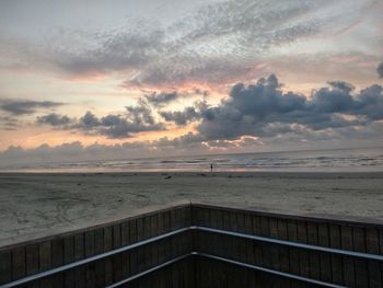 Scenic view of beach against sky during sunset