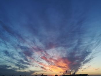 Low angle view of dramatic sky during sunset