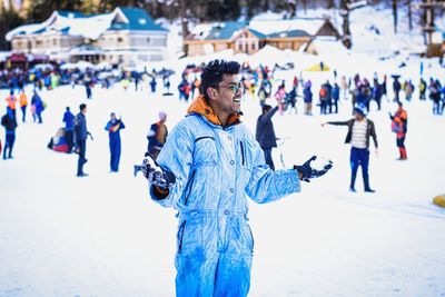People standing on field during winter