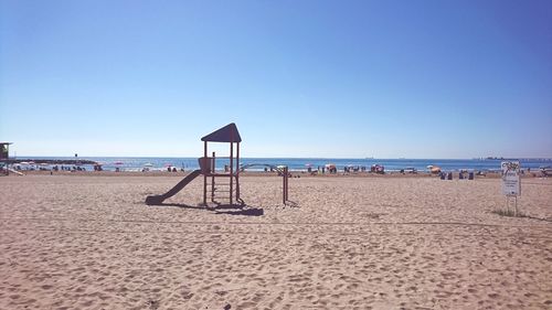 Scenic view of beach against clear sky