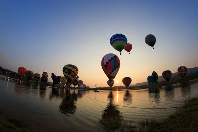 View of hot air balloons flying against clear sky