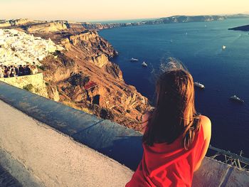Rear view of woman looking at sea