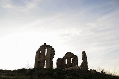 Low angle view of old ruins against clear sky