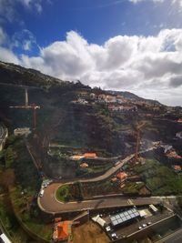 High angle view of buildings in city against sky