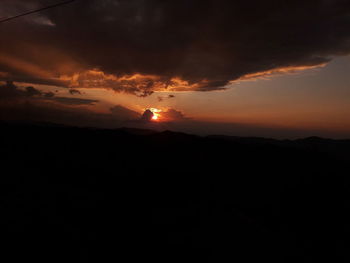 Scenic view of silhouette landscape against sky during sunset