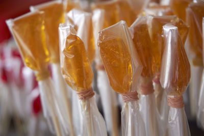 Close-up of candies wrapped in plastic for sale at market stall