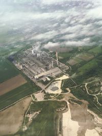 Aerial view of landscape against cloudy sky