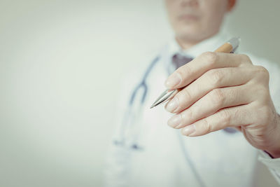 Close-up of man holding hands