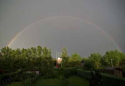 Scenic view of rainbow over landscape