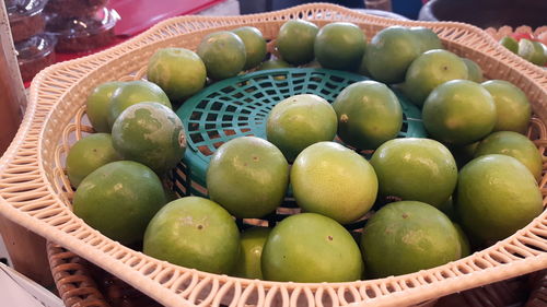 High angle view of fruits in baskets for sale at market