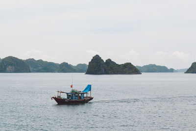 Boat in sea against sky