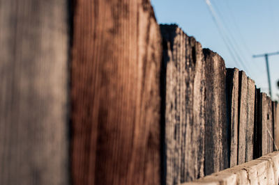 Close-up of wood against sky