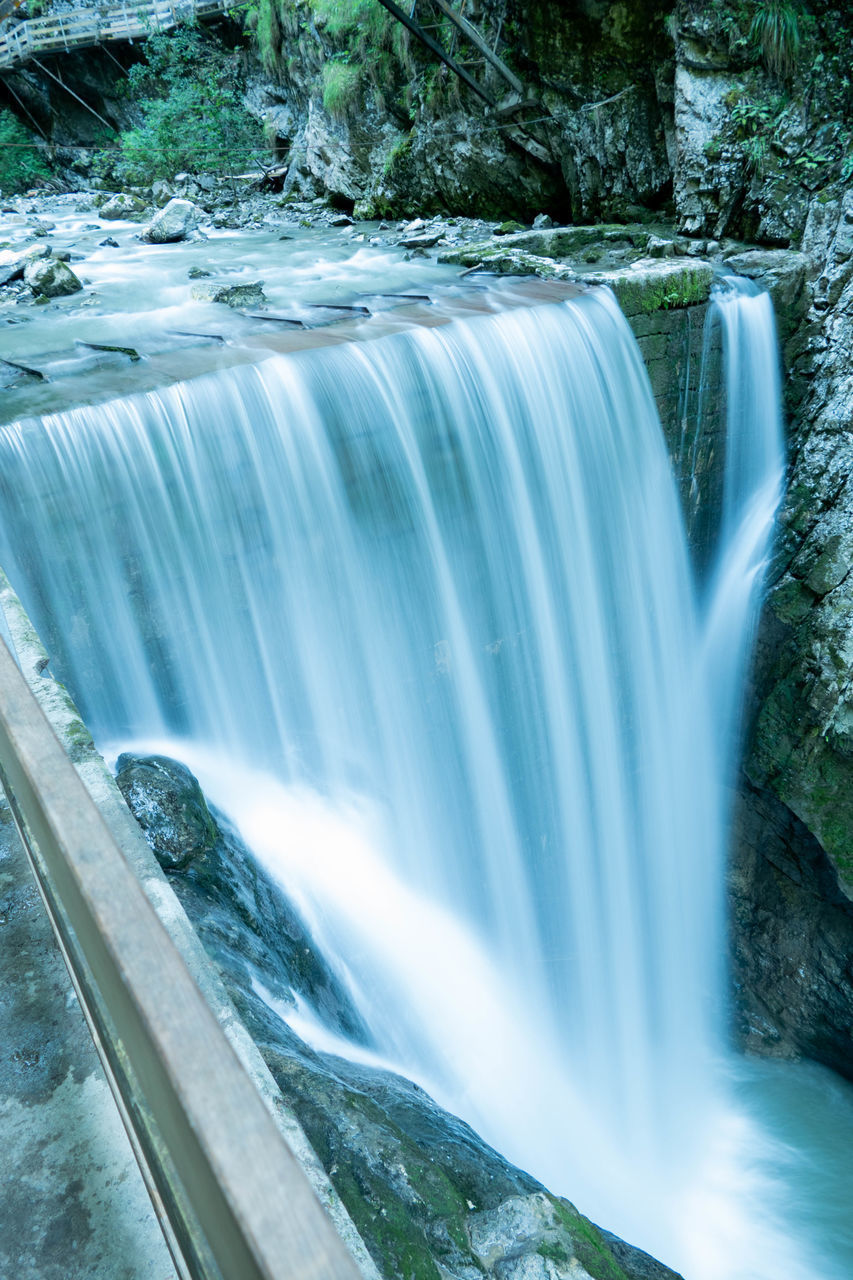 PANORAMIC VIEW OF WATERFALL IN FOREST