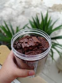 Close-up of hand holding ice cream