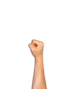 Close-up of person hand with tattoo against white background