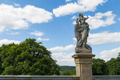 Low angle view of statue against sky