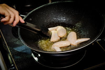 Close-up of person preparing food in kitchen