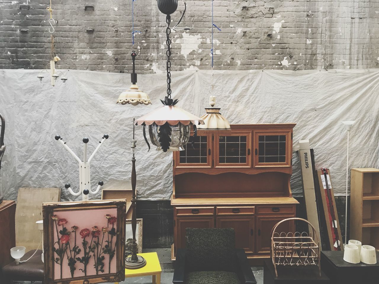 EMPTY CHAIRS AND TABLES AGAINST BUILDING