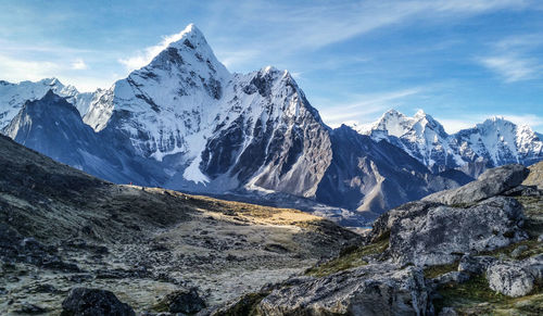 Scenic view of snowcapped mountains against sky