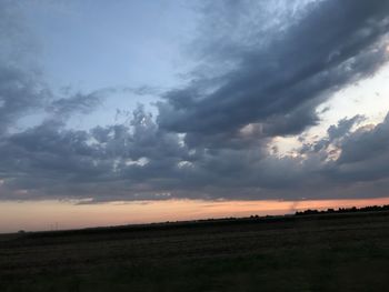 Scenic view of sunset over land