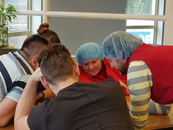 People sitting in kitchen