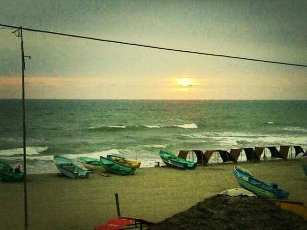 sea, horizon over water, water, nautical vessel, transportation, sky, sunset, boat, beach, moored, tranquility, tranquil scene, scenics, mode of transport, beauty in nature, nature, shore, idyllic, orange color, cloud - sky