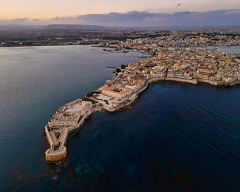 High angle view of sea against sky during sunset