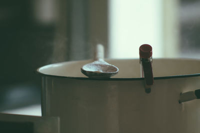 Close-up of spoon on container