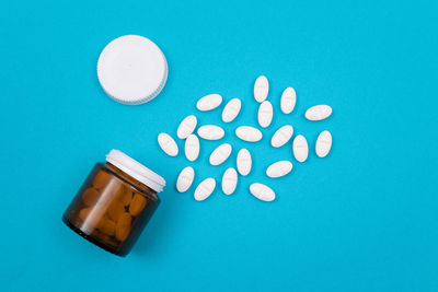 High angle view of bottle on blue background
