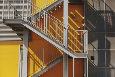 Staircase by orange wall