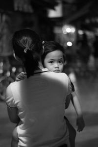 Rear view of mother with daughter